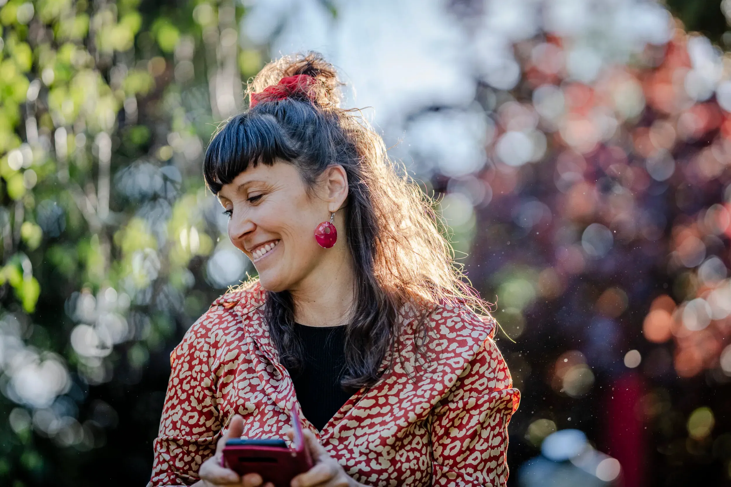 Portrait of a smiling woman in a garden